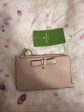 kate spade pink pebbled leather zip cardholder with bow and key ring